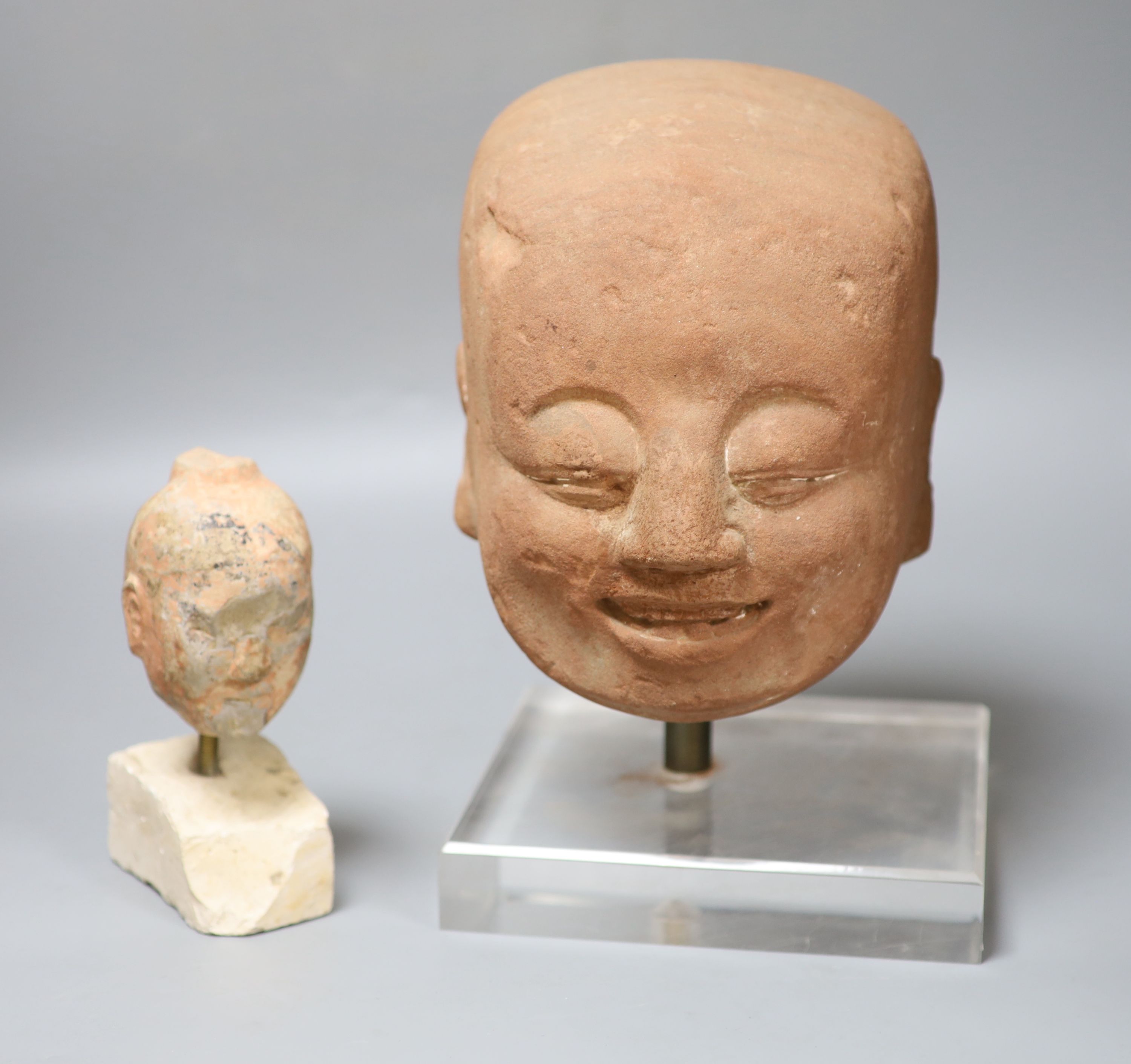 Two Chinese terracotta heads, tallest overall 30cm